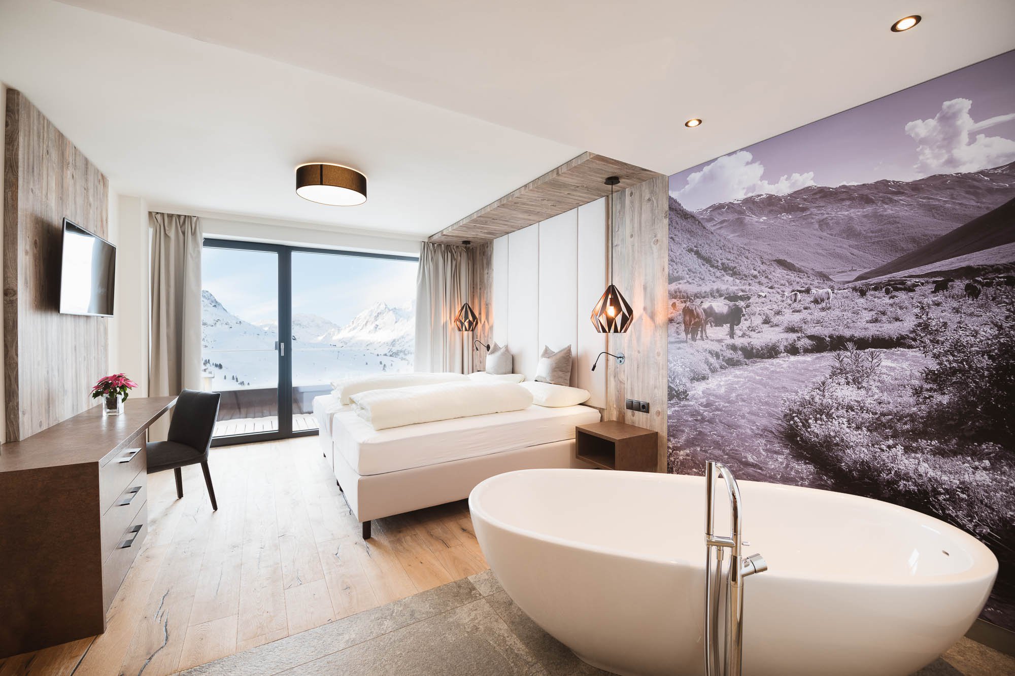 A family room with interconnecting door and a view on the slopes, modern and cosy.